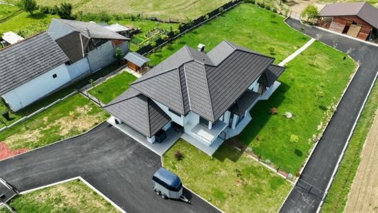 Aerial drone photograph of a property and its surrounding area