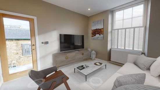 Virtually staged living room with furniture added to an empty space